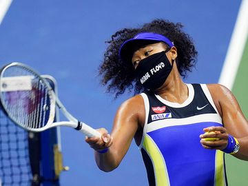 Naomi Osaka, of Japan, fires a ball into the stands after defeating Shelby Rogers, of the United States, during the quarterfinal round of the US Open tennis championships, Tuesday, Sept. 8, 2020, in New York.