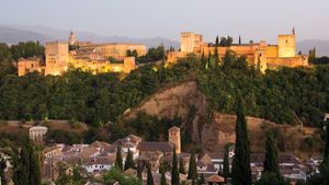 Admire the Alhambra's coloured tiles, carved stucco and wood, and calligraphy in Grenada, Spain