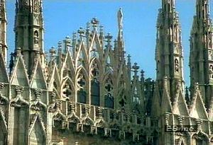 Revere the exterior of the French Gothic architectural achievement Duomo di Milano in Italy